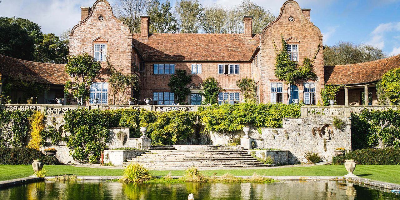 Beautiful red brick Country House wedding venue in Kent set in front of a lake